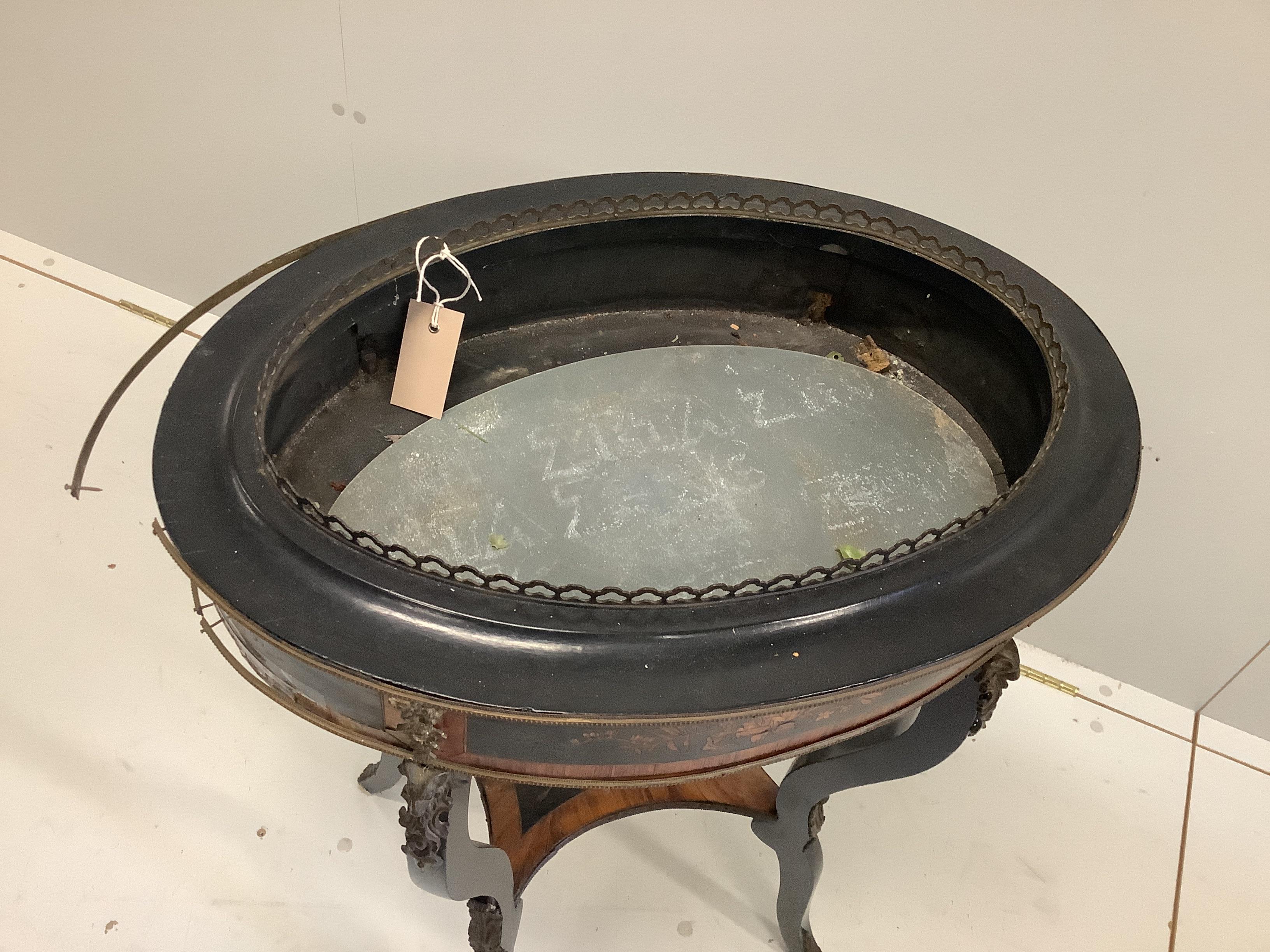 A late 19th century French marquetry inlaid ebonised and kingwood oval jardiniere table, width 56cm, depth 40cm, height 82cm